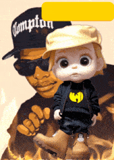 a baby wearing a wu tang shirt is standing in front of an illustration of a man wearing a compton hat