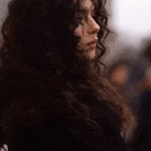 a close up of a woman 's face with her eyes closed