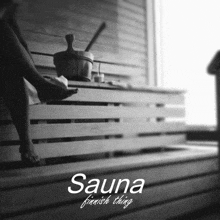 a black and white photo of a person in a sauna with the words sauna finnish thing