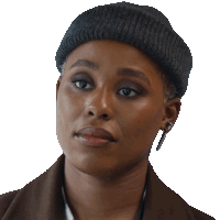 a close up of a woman wearing a hat and earbuds