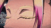 a close up of a person 's eye with pink hair and yellow eyebrows