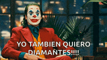the joker is wearing a clown mask and a red suit