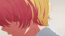 a close up of a person 's head with red hair and yellow hair