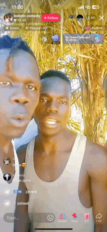 two men are standing next to each other in front of a screen that says 11:50