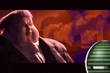 a fat man in a suit and tie stands in front of a screen that says ' a ' on it