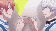 two anime characters are holding spoons in their hands and looking at each other