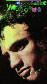 a close up of a man 's face with saint c written on the top