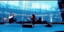 a blurry picture of a band playing on stage