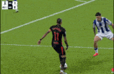 a soccer game is being played and the score is 1-0
