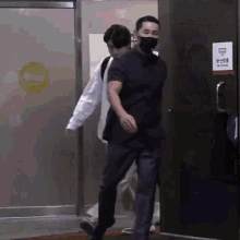 a man wearing a mask walks into a building