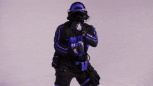 a person wearing a blue and black uniform with the word ults on it