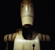 a close up of a robot 's face with holes in it