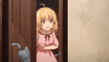 a girl in a pink dress is peeking out of a doorway