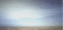 a lighthouse in the distance with a blue sky