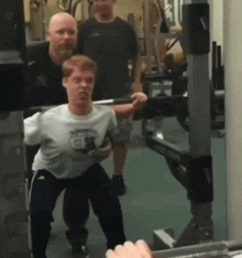 a man squatting in front of a mirror wearing a shirt that says ' abercrombie & fitch '
