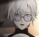 a close up of a person with white hair and glasses .
