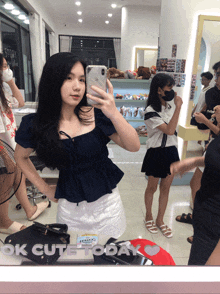 a girl is taking a selfie in front of a mirror with ok cute today written on it