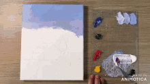 a painting on a canvas next to a palette that says made in animonica