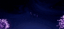 a group of people are flying through the air in front of a fireworks display