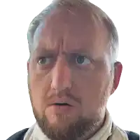 a man with a beard is making a funny face with his eyes closed