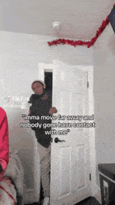 a man standing in a doorway with a tiktok caption