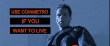 a man stands in front of a sign which says use coinmetro if you want to live