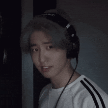 a young man wearing headphones that say pioneer