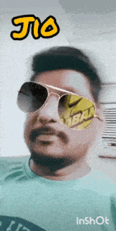 a man wearing sunglasses has jio written on the top of his head