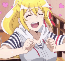 a girl with blonde hair and a striped shirt has her mouth open