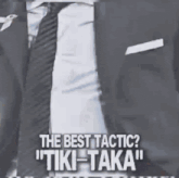 a man in a suit and tie is saying the best tactic tiki taka