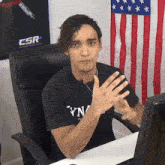 a man in a black t-shirt that says yn on it