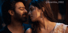 a man and a woman are looking into each other 's eyes with the hashtag avantika_0902