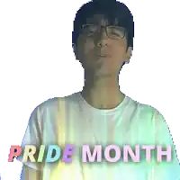 a man wearing glasses and a white shirt with the words pride month on it