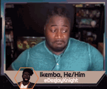 a man in a blue shirt with the name ikemba on the bottom