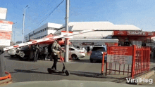 A Scooter Rider Failed To Pass Through The Barrier Gate Arm Viralhog GIF - A Scooter Rider Failed To Pass Through The Barrier Gate Arm Viralhog A Scooter Rider Was Unable To Get Past The Barrier Gate Arm GIFs