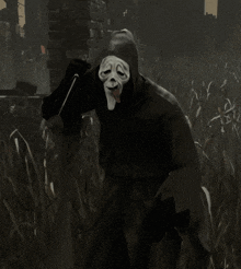 a person wearing a scream mask with a tongue sticking out