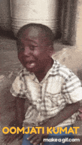 a gif of a boy with the words oomjati kumat on it