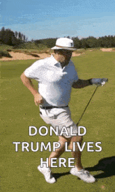 donald trump is playing golf on a golf course with a golf club .