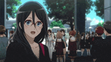 a girl wearing glasses is standing in a crowd of people