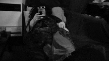 a black and white photo of a person surrounded by a spiral