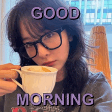 a woman wearing glasses holds a cup of coffee with the words good morning above her