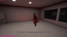 a man in a red suit is kneeling down in a room with russian writing on the wall behind him