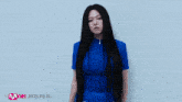 a woman in a blue dress with the word four on her skirt