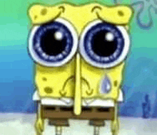 spongebob squarepants is crying with a tear running down his nose .