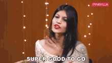 a woman says super good to go in front of pinkvilla
