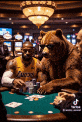 a man in a lakers jersey is playing poker