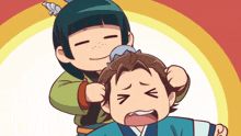 a girl is brushing a boy 's hair with a brush