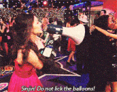 a woman in a red dress says sinjin do not lick the balloons in front of a megaphone