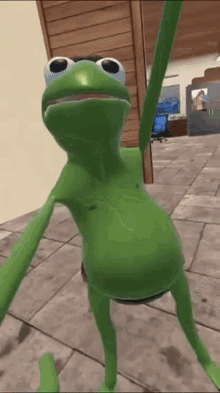 a green frog is standing on a tiled floor with its arms outstretched .