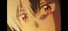 a close up of a person 's face with red eyes